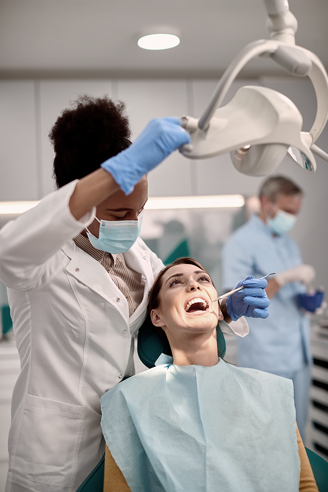 Dentist examining patient